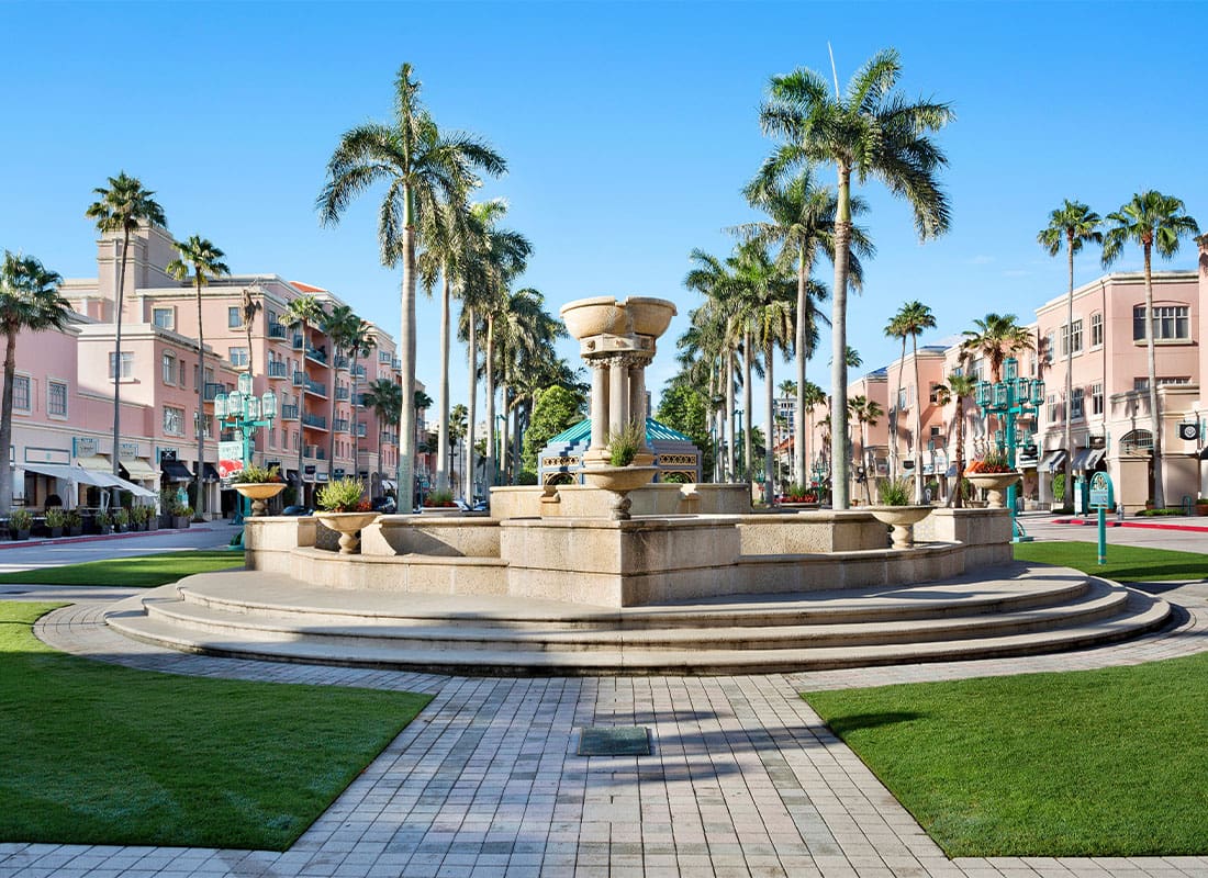 Boca Raton, FL - Mizner Park With a Beautiful Fountain and Palm Trees in Boca Raton, Florida